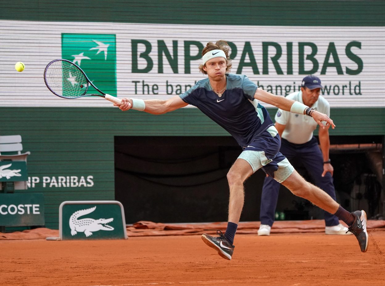 PARIS, FRANCE - JUNE 1, 2022: Professional tennis player Andrey Rublev of Russia in action during his quarter-final match against Marin Cilic of Croatia at 2022 Roland Garros in Paris, France — Photo by zhukovsky